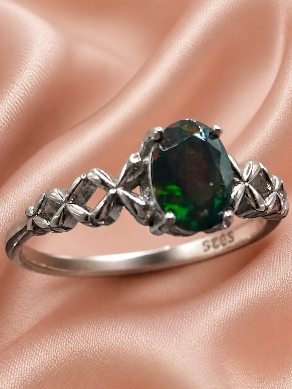 Genuine black opal set in rhodium over S925 crisscross design ring. Brand new!